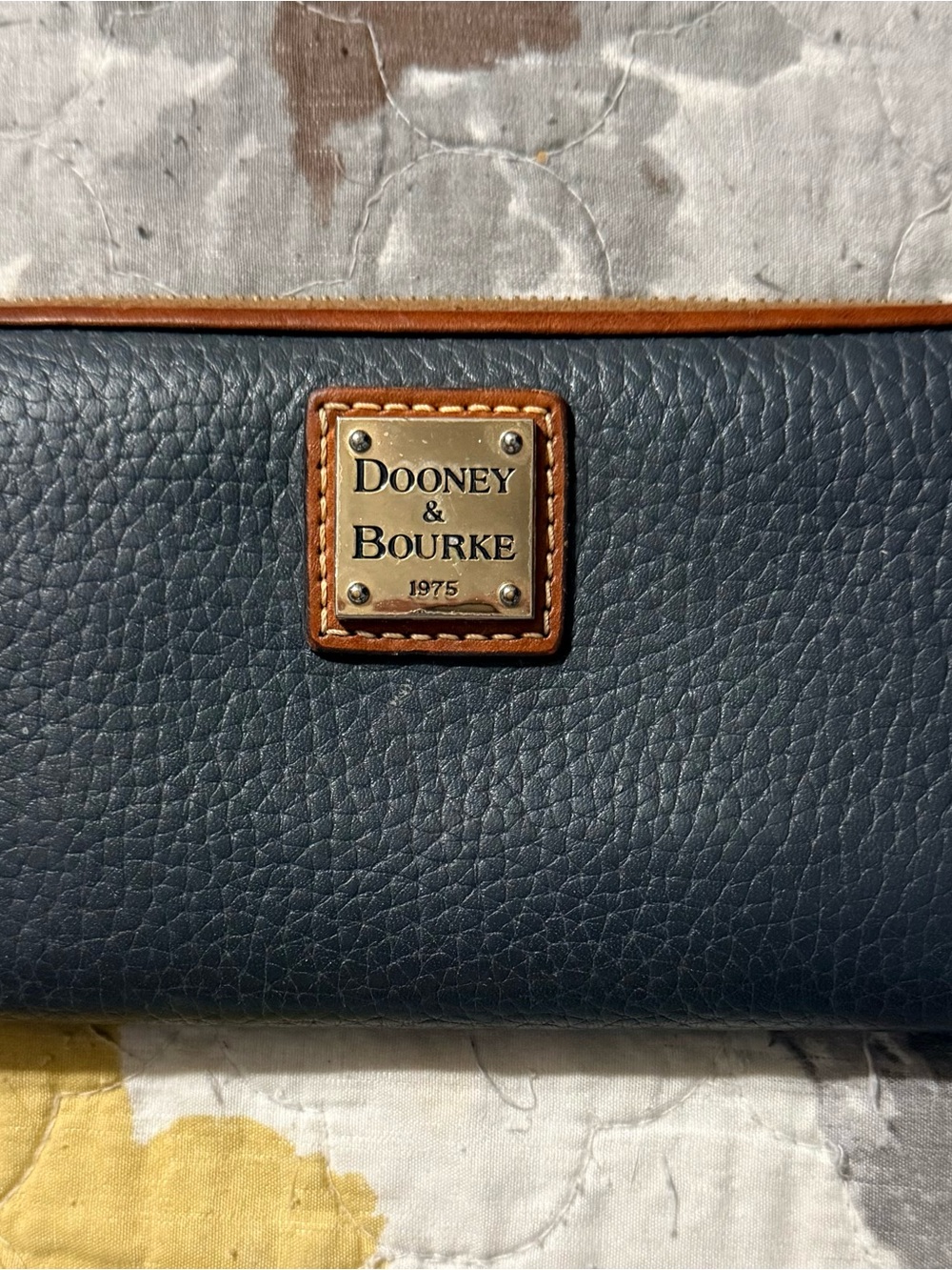 Dooney & Bourke Navy Pebbled Leather Wallet with Tan Trim and Brass Plaque